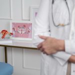 Doctor explains cervical cancer screening to female patient
