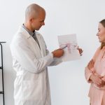 Doctor consulting patient about gynecology and fertility